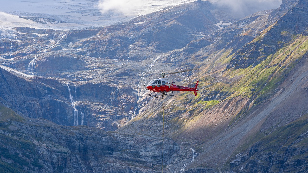 Helicopter flying over the green sea cliffs of Kauai